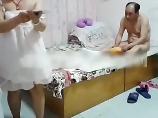 Chinese tolerant and her man at the hotel